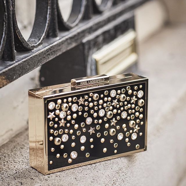 Our new multistuds minaudiere will hold your night essentials.   Get yours now by clicking the link in our bio   
#KARLLAGERFELD