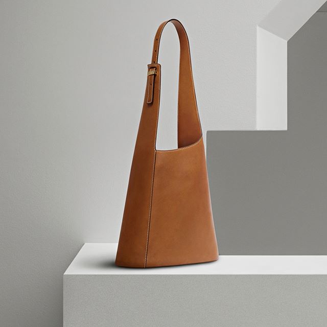 The new Asymmetric Bucket Bag. Now available at victoriabeckham.com and 36 Dover Street, London. #VBPreSS18 #VBDoverSt