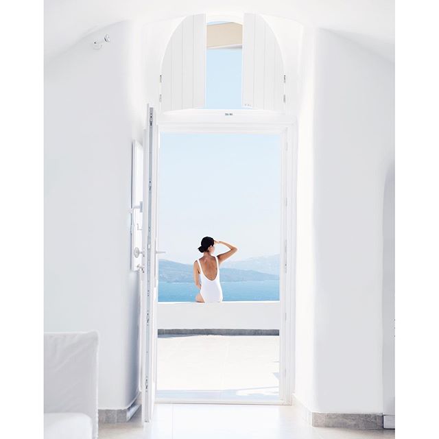 Ethereal morning waking up at @santorinisecret perched atop the volcanic cliffs of Oia  